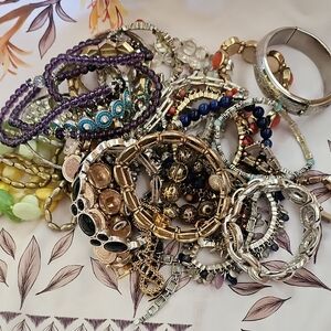 31 Piece Bag Of Bracelets Some Can Be Parted Out To Make New Ones.